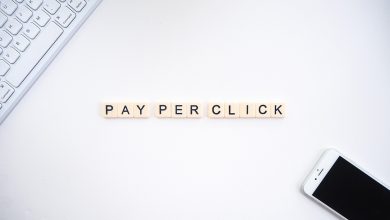 The “pay per click” words between a smartphone and a keyboard as an introduction to PPC marketing